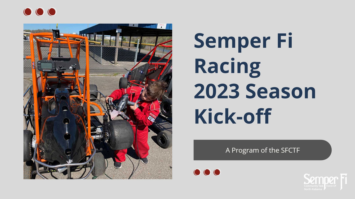 Semper Fi Community Task Force Racing team prepares for a race, a boy works on the tire of a quarter midget race car