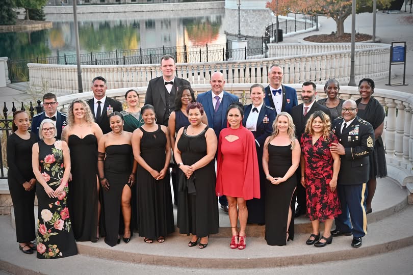 Group of men and women in formal wear, ready to attend the USMC Birthday Ball